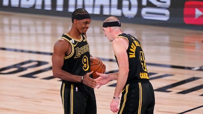 Los Angeles Lakers' Rajon Rondo (9) and Alex Caruso (4) celebrate their 124-114 win against the Miami Heat. AP