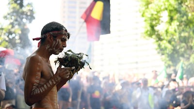 A person participates in an Indigenous smoking ceremony during an 'Invasion Day' Rally on Australia Day in Sydney. EPA