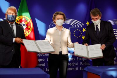 Portugal's Prime Minister Antonio Costa (L), European Commission President Ursula von der Leyen (C) and European Parliament President David Sassoli after a signing the EU Recovery and Resilience Facility document, designed to help to stem the economic impact of Covid-19, in Brussels, Belgium, February 12. EPA