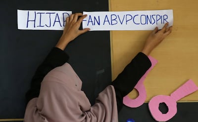 Indian Muslim girl prepares for panel discussion on the wearing of hijab in Bangalore. EPA