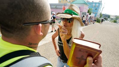 Derenda Hancock, co-director of the Jackson Women's Health Organisation clinic patient escorts, speaks with anti-abortion advocate Boris Campos outside the clinic in Jackson, Mississippi. AP