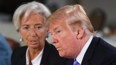 IMF Managing Director Christine Lagarde speaks to US President Donald Trump. Neil Hall / EPA