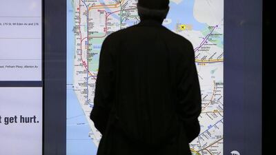 A man looks at a digital subway map at the new Fulton Center. Andrew Gombert / EPA