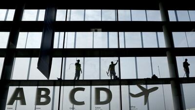 Workers clean the windows in the departure area at Vienna’s airport in Schwechat. As many as 425,000 passengers were affected by the three-day strike of Lufthansa pilots. Leonhard Foeger / Reuters