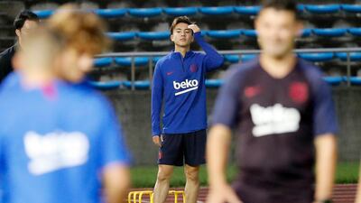 Hiroki Abe warms up during a training session at the Machida Municipal Athletic Stadium. AP Photo