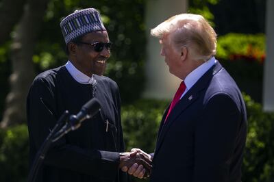 US President Donald Trump shakes hands with Muhammadu Buhari, Nigeria's president, in the Rose Garden of the White House last year. Al Drago / Bloomberg