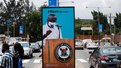 A billboard campaigning for the prevention of the coronavirus is seen standing in a neigbourhood in Lagos. EPA