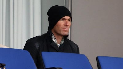 Real Madrid's assistant coach Zinedine Zidane watches as he son, whose full name is Enzo Alan Fernandez Zidane, plays with Real Madrid's Under-19 team on Tuesday. Charles Platiau / Reuters / March 11, 2014