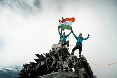 The duo on a mountain top during the 100% Women Peak Challenge. Photo: Nicole Schafer Photo & Film