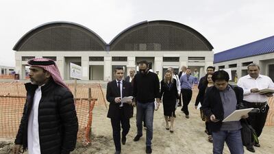 Journalists and dignitaries tour the night market on Nakheel's Deira Islands project in Dubai. Christopher Pike / The National