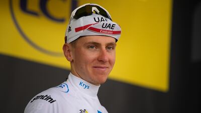 UAE Team Emirates rider Tadej Pogacar, wearing the best young rider's white jersey on the podium after stage 19 on Friday. AP