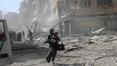 Syrians run for cover after government air strikes on the Eastern Ghouta rebel-held enclave of Douma, on the outskirts of Damascus on March 20, 2018. AFP Photo