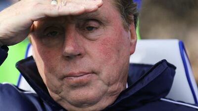 Harry Redknapp looks on during a Queens Park Rangers match against Wigan Athletic on April 7, 2013. Andrew Cowie / AFP