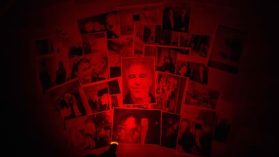 This photograph taken in Le-Perreux-sur-Marne, outside Paris on February 9, 2026 shows undated pictures provided by the US Department of Justice on January 30, 2026 as part of the Jeffrey Epstein files. US authorities on January 30, 2026, released the latest cache of files related to the investigation into the late conviceted sex offender Jeffrey Epstein. The files contained references to numerous high-profile figures. (Photo by Martin BUREAU / AFP)