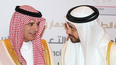 Sheikh Abdullah bin Zayed greets Adel Al Jubeir at the OIC Ministerial meeting at Emirates Palace in Abu Dhabi. Chris Whiteoak / The National