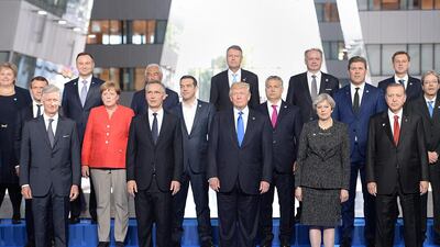 US president Donald Trump is pictured with the leaders of Nato member countries and the alliance's secretary general, Jens Stoltenberg (front row, second left), during a summit on May 25, 2017 in Brussels, Belgium. Stefan Rousseau - Pool / Getty Images