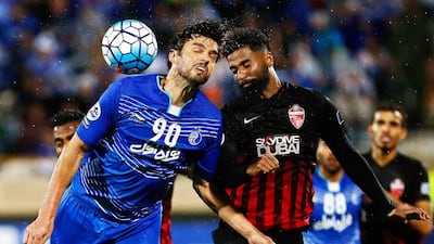 Esteghlal's Leandro Padovani, left, in action with Al Ahli's Abdelaziz Sanqour (62) during their Asian Champions League match at the Azadi Stadium in Tehran, Iran, on April 25, 2017. Abedin Taherkenareh / EPA
