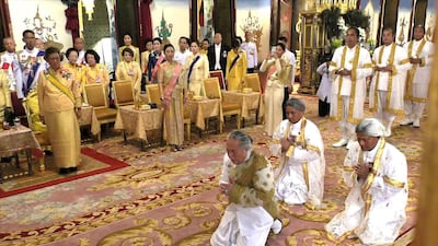 This screengrab shows Chief Brahmin Phra Ratcha Khru Vamadeb Muni (front centre) addressing Thailand's King Maha Vajiralongkorn during his coronation in Bangkok. AFP