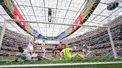 Austria goalkeeper Alexander Schlager is left sitting on the goal line as Mikel Oyarzabal opens the scoring for Spain. AFP