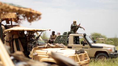 Malian soldiers and members of the new Takuba force on patrol near the Niger border in Dansongo Circle, Mali, on August 23. Reuters