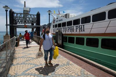 Passengers disembark from a ferry at Phi Phi island in Thailand. AFP