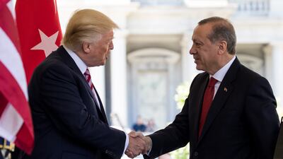 US President Donald Trump greets President Recep Tayyip Erdogan of Turkey at the White House in May 2017. Getty Images