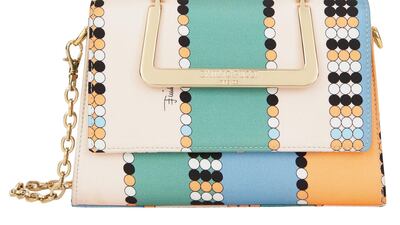 Emilio Pucci: Retro colours of apricot, cream and seafoam are updated into a hard-sided satin bag, with a gold buckle and chain strap.