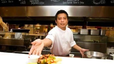 Nhonie Flores prepares pinoy chicken barbecue skewers, lumpiang prito and fried spring rolls at Lafayette Gourmet in Dubai Mall.