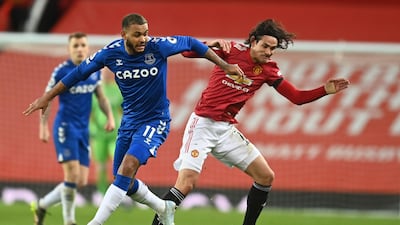 Everton's Joshua King, left, challenges for the ball with Manchester United's Edinson Cavani during the match between Manchester United and Everton at Old Trafford. AP.