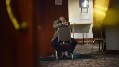 A relative of passengers from the missing Malaysian Airlines Flight MH370 waits for new information at a hotel in Beijing on March 15. The needle-in-a-haystack hunt for the missing Malaysian airliner spread to the vast Indian Ocean on March 14 after the White House cited "new information" that it might have flown for hours after vanishing nearly seven days ago. Wang Zhao/AFP Photo