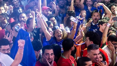 French fans celebrate their team's win much to the dismay of Moroccan supporters.