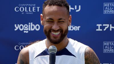Paris Saint-Germain's Neymar answers a question from a child. AP Photo