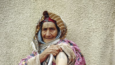 Aisha in Tunisia, who had tattoos on her arms and face. She was a belly dancer and had many tattoos to emphasize her beauty. Courtesy Yumna Al-Araishi