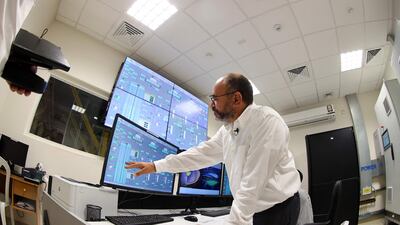 Saud Abdulaziz Abdul Ghani displays readings on a screen during a tour of the cooling system at the Al Janoub Stadium in Doha.