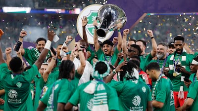 Al Ahli players celebrate with the trophy after winning the AFC Champions League title, courtesy of a 1-0 win over Machida Zelvia at King Abdullah Sports City Stadium in Jeddah, Saudi Arabia. Getty Images