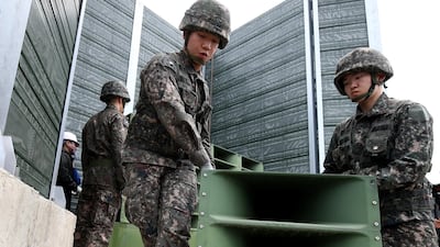 South Korean soldiers take down a propaganda loudspeaker on the border with North Korea in Paju, South Korea. Chung Sung-Jun / EPA