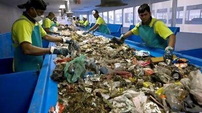 Some of Bee’ah’s 120 separators search through rubbish for aluminium, plastic, paper and cardboard to be recycled at the company’s waste recovery centre in Sharjah. Their search may soon be easier.