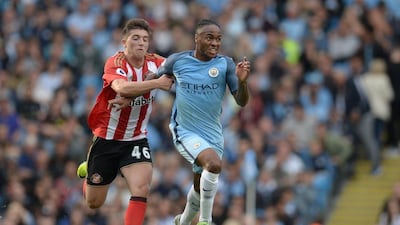 Sunderland midfielder Lynden Gooch (L) challenges Manchester City midfielder Raheem Sterling (R) during the Premier League football match between Manchester City and Sunderland at the Etihad Stadium in Manchester, north west England, on August 13, 2016. Oli Scarff / AFP