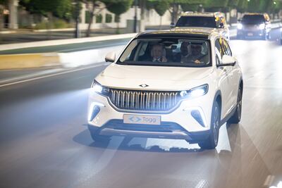 President Sheikh Mohamed and Mr Erdogan drive a Turkish-made Togg electric car in Abu Dhabi. Hamad Al Kaabi / UAE Presidential Court