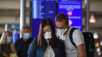 Passengers bound for Frankfurt wait at a terminal of Dubai International Airport.