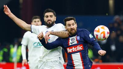 Lionel Messi in action with Marseille's Samuel Gigot. Reuters