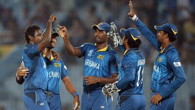 Sri Lankan players celebrate a huge victory over the Netherlands team that has all but secured a semi-final place for the subcontinental side. Prakash Singh / AFP / March 24, 2014