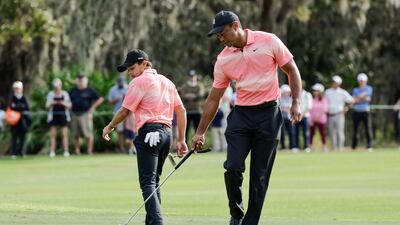 Tiger and Charlie Woods on the ninth green during the first round of the PNC Championship. AP