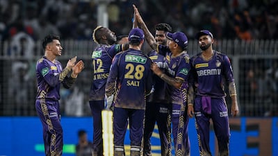 Kolkata Knight Riders' Andre Russell, second left, celebrates with teammates after taking the wicket of Royal Challengers Bengaluru's Rajat Patidar during the Indian Premier League game at Eden Gardens in Kolkata on April 21, 2024. Kolkata won the match by one run. AFP