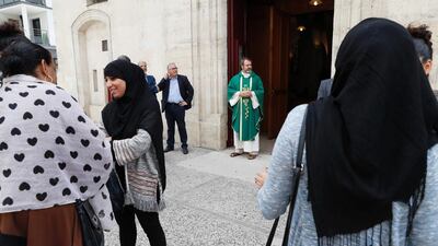 Christian and Muslim worshippers attend a mass in tribute to Father Jacques Hamel. Thomas Samson / AFP