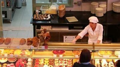 Cakes and pastries on display at the Paul Bakery & Restaurant in Dubai Mall. Traditionally, UAE retail stores have been staffed by Asian shop assistants but now more are coming from Europe.
