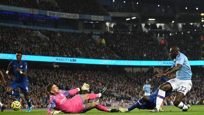 Chelsea's French midfielder N'Golo Kante shoots past Manchester City's Brazilian goalkeeper Ederson. AFP