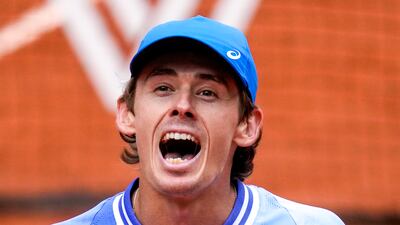 Alex De Minaur celebrates winning against Daniil Medvedev. AP