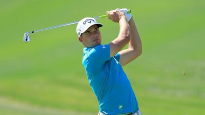 Haydn Porteous of South Africa plays his second shot at the par 4, first hole during the third round of the Dubai Desert Classic on Saturday. David Cannon / Getty Images / February 6, 2016