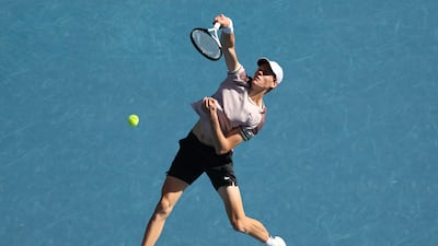 Jannik Sinner plays a smash on his way to a four-set victory against Novak Djokovic in their Australian Open semi-final. Getty Images